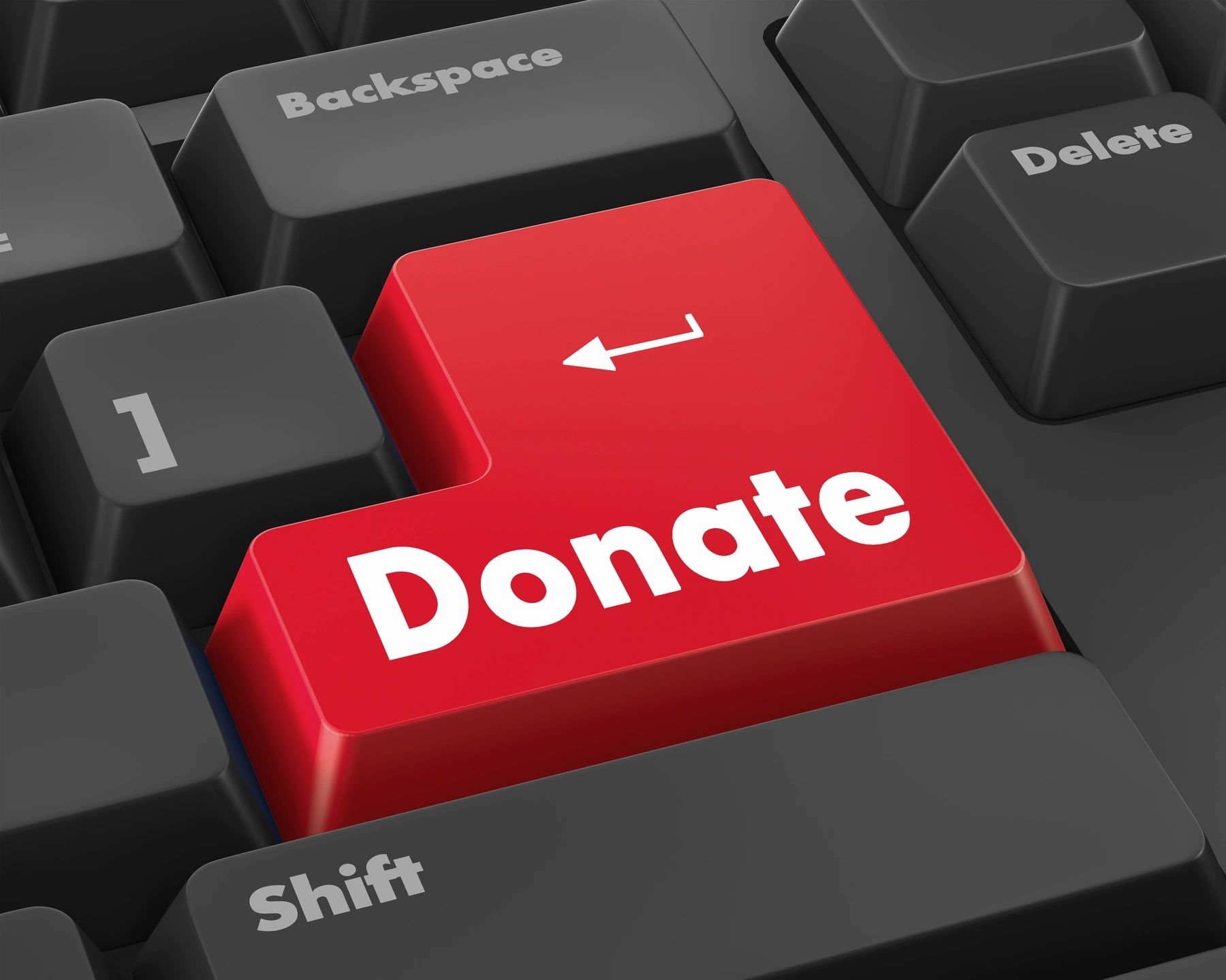 Donate key on keyboard symbolizing charitable giving