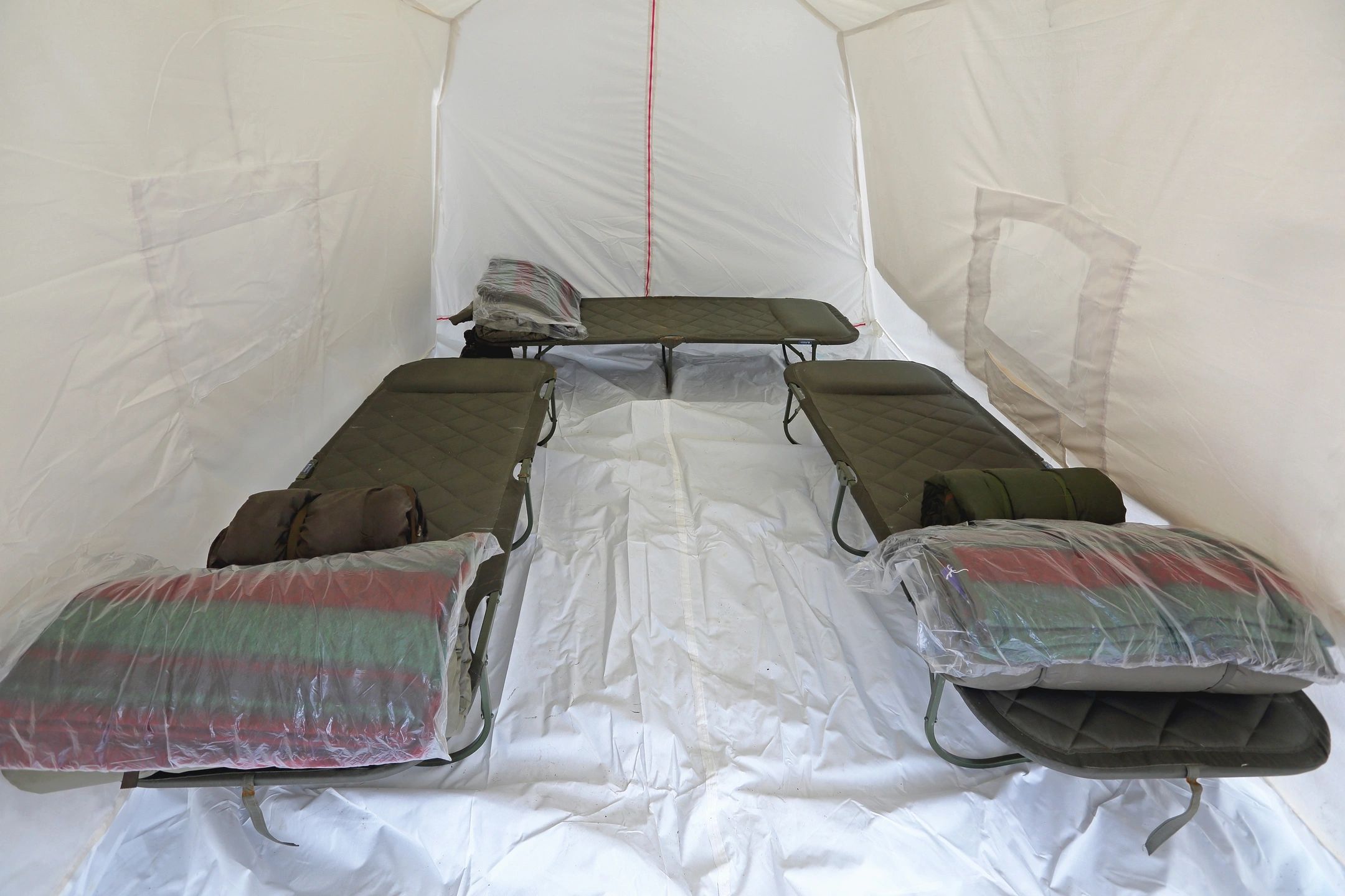 Canvas tent shelter with cots
